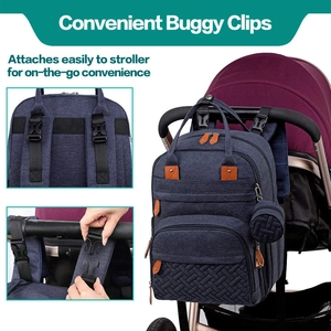 Close-up of durable baby buggy clips on a waterproof navy blue diaper backpack