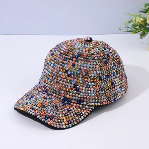 Close-up of vibrant multicolored rhinestones on a high-quality sparkling baseball cap