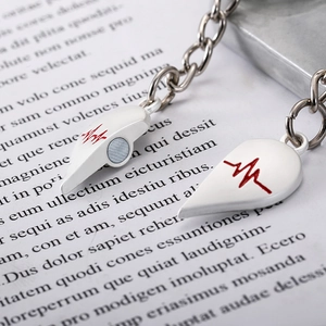 Creative heart and key magnetic couple keychain with red heartbeat electrocardiogram pattern