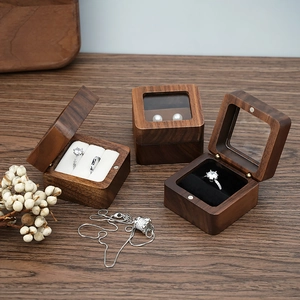 Three-piece walnut wood jewelry box set with velvet lining and glass window lid