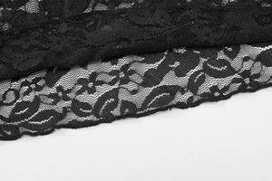 Détail de tissu en dentelle noire avec motifs floraux pour hauts moulants et sexy