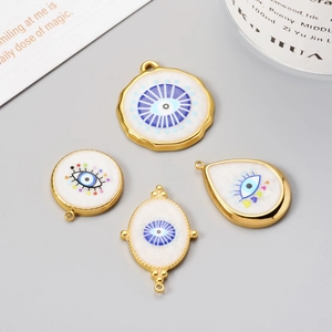 White enamel evil eye charms in gold finish for DIY jewelry and necklaces
