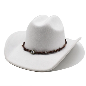 Close-up of white felt cowboy hat with braided band and evil eye charm detail