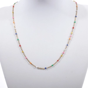 Detail of gold-plated stainless steel chain necklace with colorful enamel bead accents