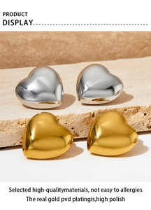 Detail of PVD gold plated heart earrings with high polish finish and anti-allergy metal