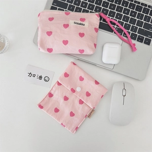 Detailed shot of pink heart canvas tote bags with zipper and snap button closures