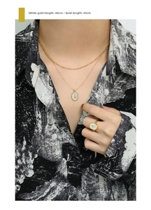 Detailed close-up of S925 silver tulip necklace with oval shell inlay on model