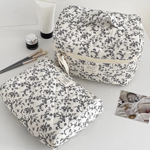 Two-piece quilted cotton toiletry bag set with black and white floral print