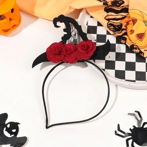 Detail of Halloween witch hat headband with red roses and black mesh against festive decor