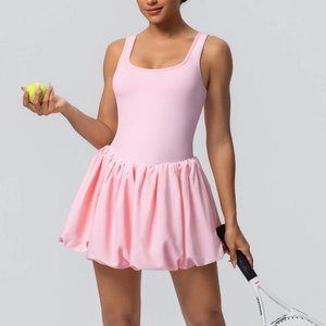 Pink sleeveless tennis dress with racerback detail and flared skirt for fitness