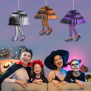 Halloween hanging honeycomb witch legs decoration set in a family party home setting