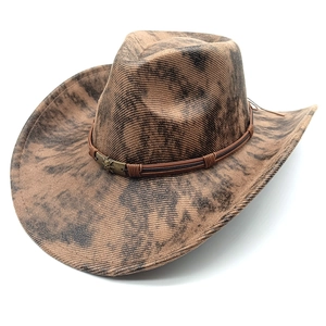 Vintage suede jazz hat with distressed cowboy style and metallic skull leather band