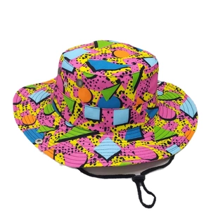 Memphis art style sun hat with geometric prints, leopard spots, and adjustable chin strap