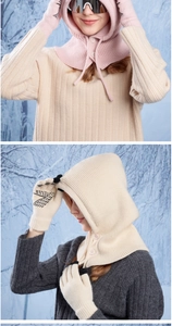 Close-up of knitted balaclava with cat whisker patterns and matching winter gloves