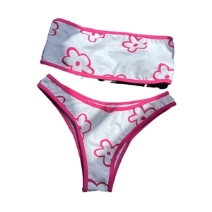 Chic bandeau bikini set with pink floral print and high-cut bottom on white background