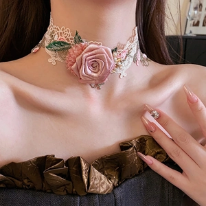Elegant white lace choker necklace with pink fabric flower, pearls and sparkling rhinestones