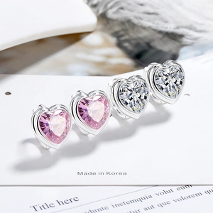 Fashion heart-shaped earrings with pink and clear zircon crystals set in silver hoops