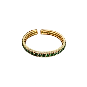 Elegant gold open bangle featuring a square emerald gemstone and paved diamonds accent