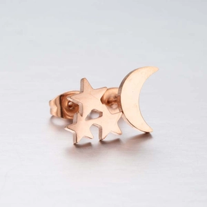 Detailed close-up of rose gold moon and stars stud earring with minimalist metal finish