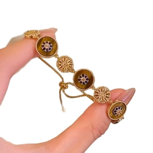 18k gold plated bracelet featuring tiger eye stones and adjustable slider clasp