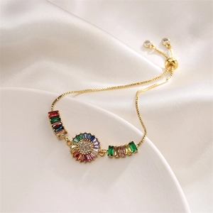 Detail of colorful zircon heart bracelet with gold plating and adjustable draw chain
