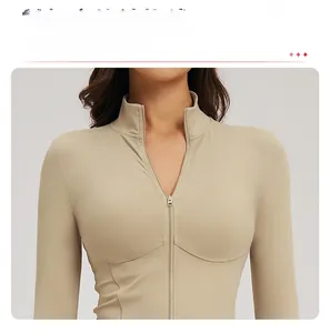 Macro view of khaki yoga top showing 3D structural stitching and half-zip collar detail