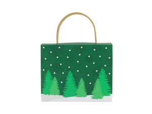 Close-up of a Christmas candy gift box with a forest print and thick paper handle