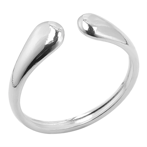 Macro detail of silver teardrop open ring showing the smooth polished metallic surface