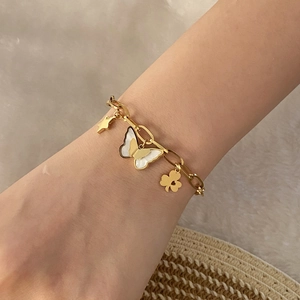 Gold butterfly and star charm bracelet for women with mother-of-pearl inlay