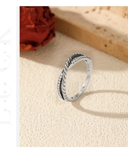 Detailed macro shot of vintage S925 sterling silver twist ring with zircon inlay