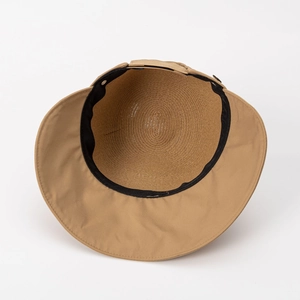 Women's khaki straw sun hat with wide brim and metal detail for summer beach protection