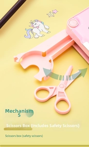 Detail of pink stationery box with pop-up compartment and pink safety scissors
