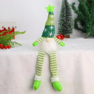 Christmas gnome doll with green knitted snowflake hat, long legs and glowing star ornament