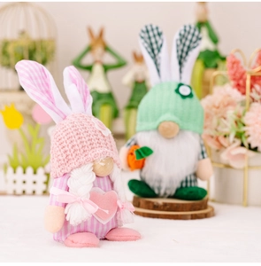Detailed close-up of handmade Easter plush gnomes with pink and green fabric textures