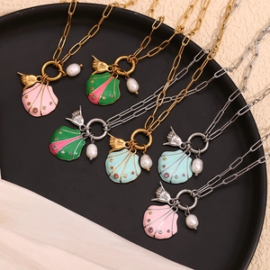Macro view of colorful shell pendants with gold and silver chain necklaces