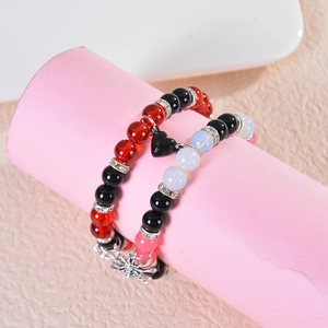 Magnetic couples beaded bracelets with heart and spider charms in natural stone and crystal
