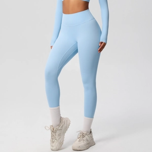 Side view of high-waist light blue yoga leggings showing sculpting fit and tummy control