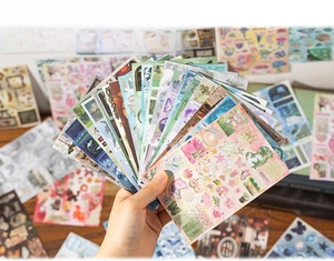 Close-up of vintage sticker book with 30 unique floral and nature designs for journaling