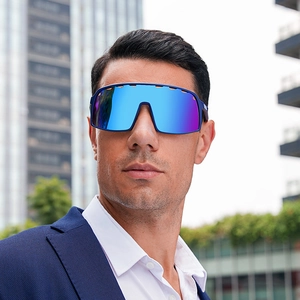 Blue mirrored cycling sunglasses worn by a model in a modern urban city setting