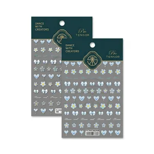 3D embossed light blue nail stickers with heart, flower, and bow designs for manicure