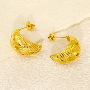 Twisted crescent hoop earrings in gold finish with a textured woven surface design