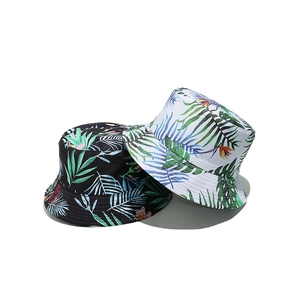 Reversible tropical leaf print bucket hat in black and white for summer sun protection