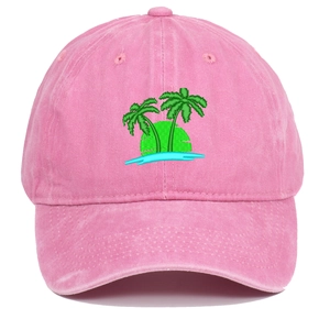 Close-up of pink baseball cap featuring detailed embroidered coconut tree and sunset design