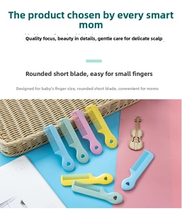 Detail of colorful baby combs with rounded teeth for gentle scalp care and heart handle
