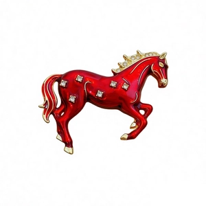 Vintage red enamel horse brooch with gold trim and sparkling crystals for women