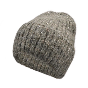 Detailed texture of moss green chunky knit beanie with white speckled pattern and thick cuff