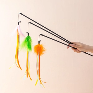 Three cat wands with colorful feathers, ribbons and bells for interactive pet play