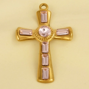 Detail of a 304 stainless steel cross pendant with pink gemstones and gold plating
