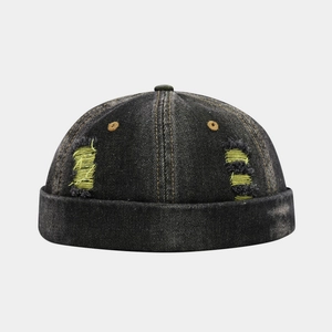 Distressed grey denim docker hat with stylish yellow ripped details and vintage wash finish