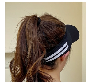 Detail of black sun visor hat with white stripes, perfect for high ponytails and sports